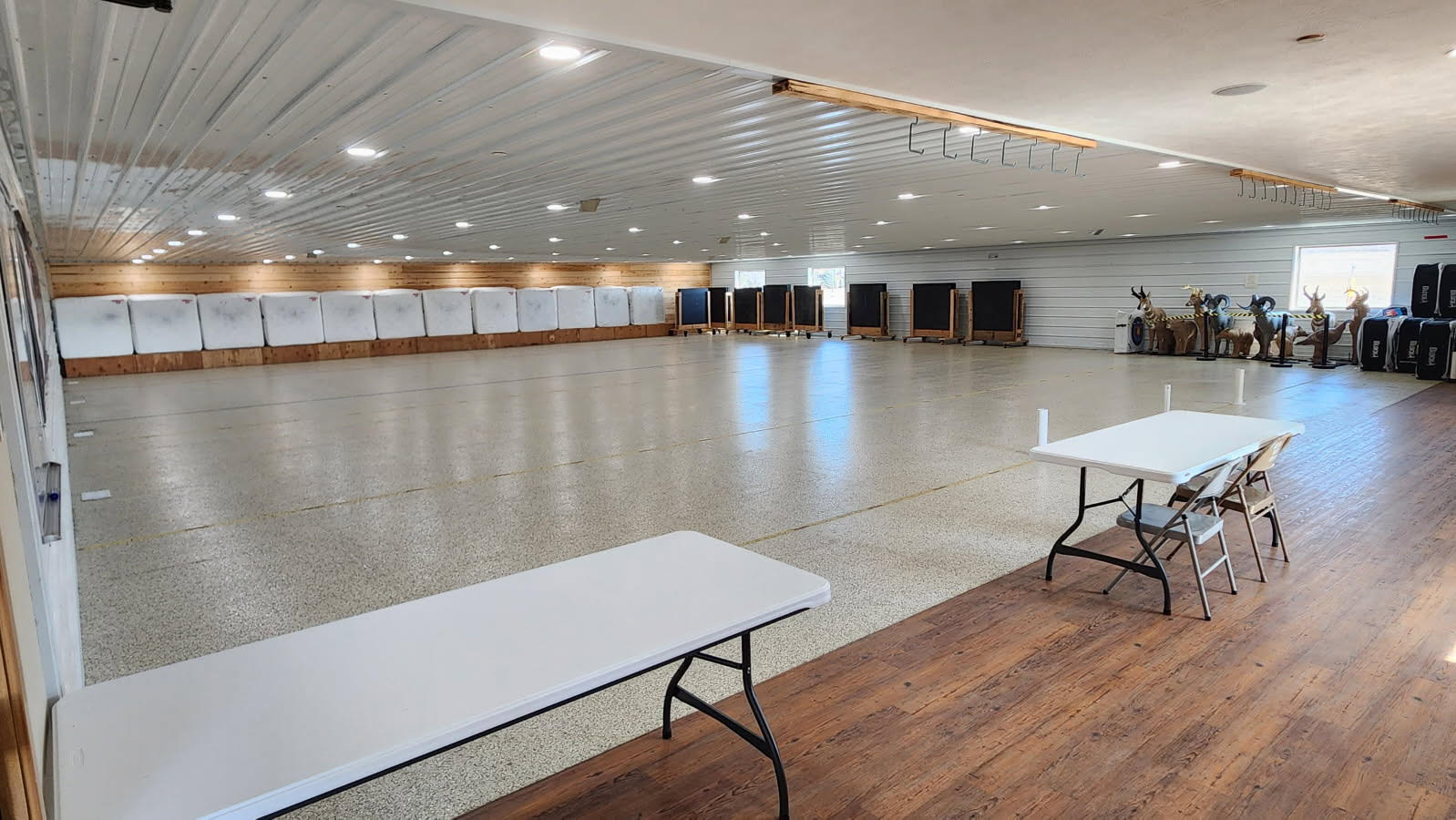 Private 20 yard indoor archery lane with targets and tables