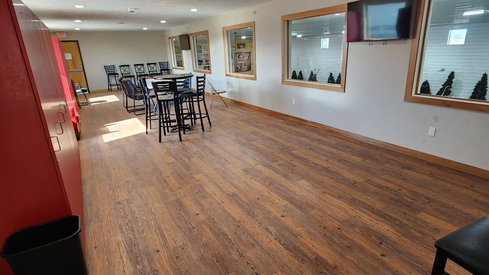 Customer waiting area and viewing gallery with seating and windows overlooking the ranges